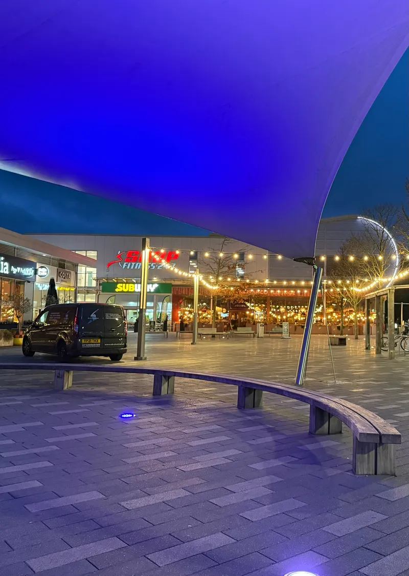 Outdoor festoon lighting installation at a retail park in Stoke Gifford, Bristol